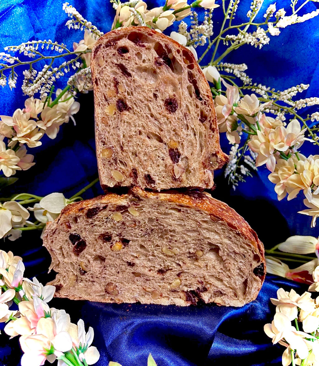 Two slices of bread on a blue fabric background with flowers