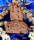 Two slices of bread on a blue fabric background with flowers
