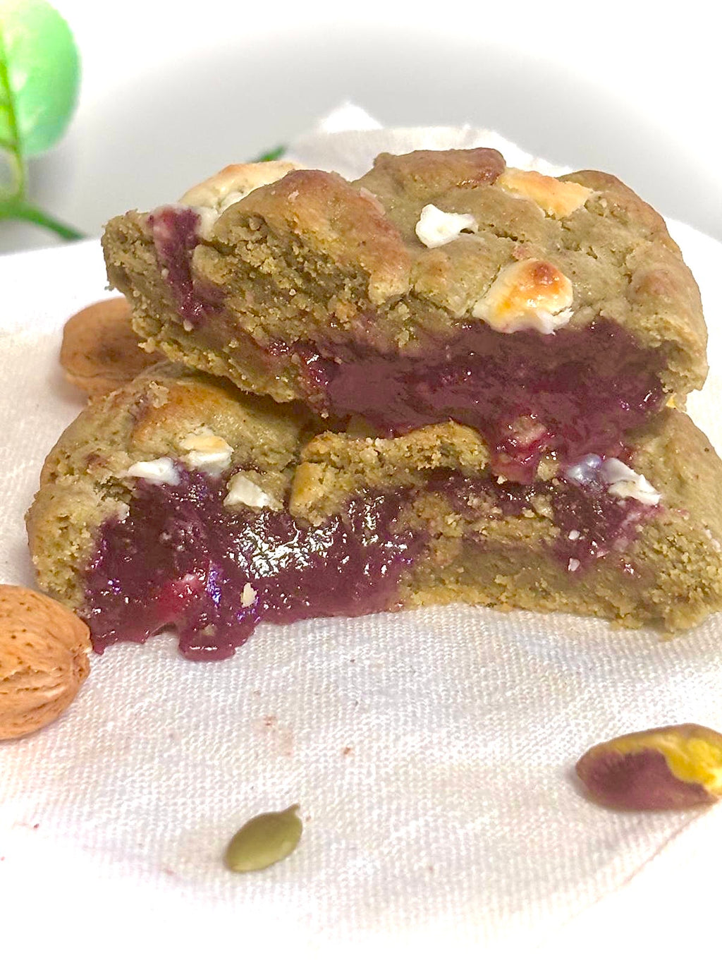 Cookies with a purple filling on a white cloth